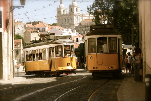 Travel writing and cultural immersion, here among the trams in Lisbon, Portugal.