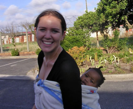 Author carrying a Ugandan infant.