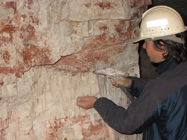 Work abroad doing archeology discovering carvings in a cave.