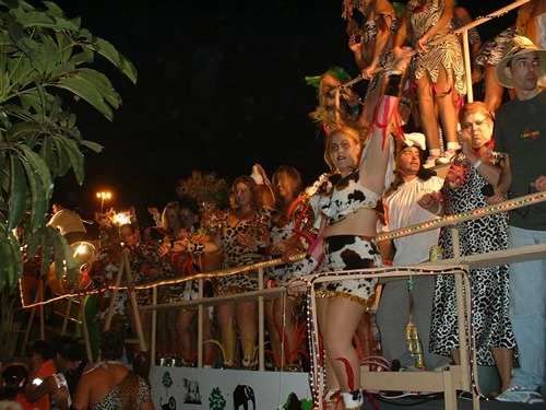 A carnival in the Canary Islands with people dancing on a float.
