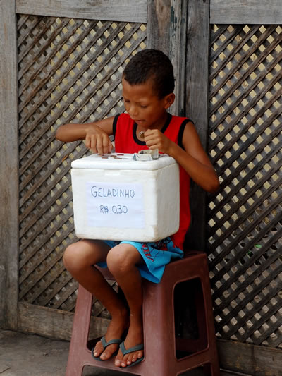 Ice cream vendor counting his blessings in Lencois, Brazil