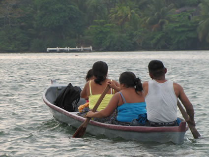 Locals on a boat in Rio Dolce, Guatemala.