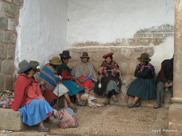 Indigenous people from Latin America sitting and talking.