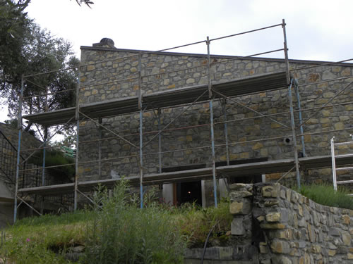 Scaffolding for volunteer work on the old stone house.