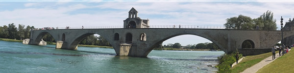 Family travel in Avignon, France can involve singing on the famous bridge.