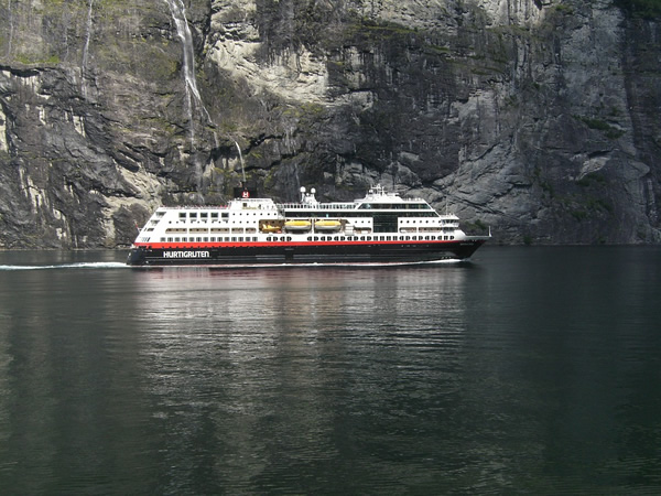 Hurtigruten in Norway passing by a fjord