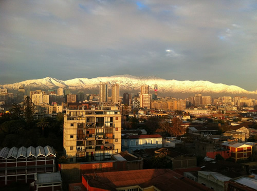 View of Santiago de Chile with snow-capped mountains in background.