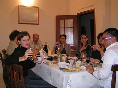 Dining and speaking Italian in Italy to hosts.