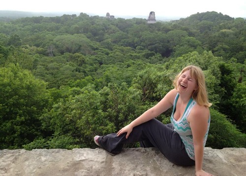 The author enjoys overlooking the forest and ancient ruins during her archeological studies.