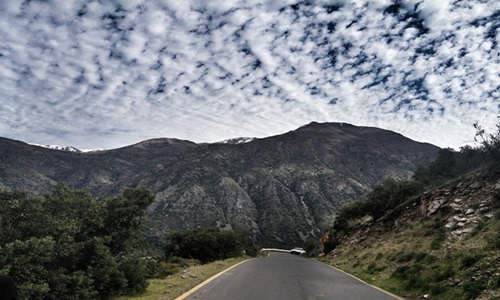Driving on the road up the Cordillera hills on the way to the Andes.