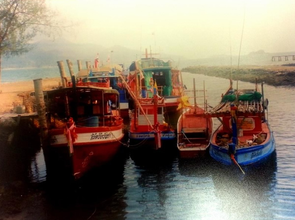 Brightly colored fishing boats in Ko Samed, Thailand.