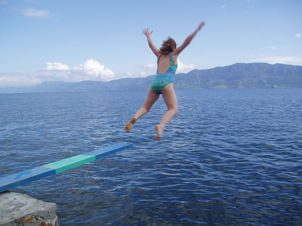Diving into Lake Toba, Indonesia.