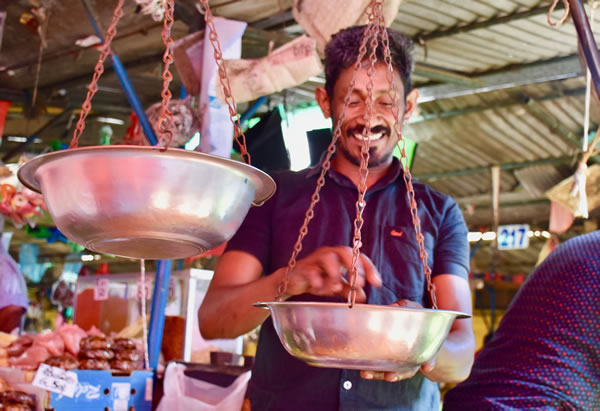 Vendor at Kandy's fruit market