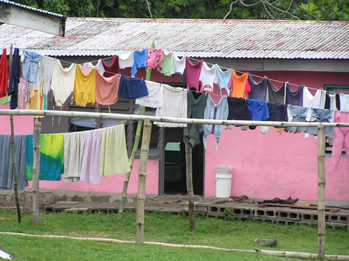 Clothes on a clothesline outside a house in Fiji.