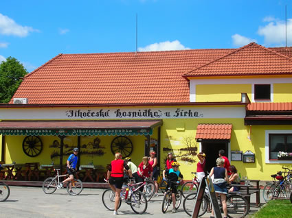 Cyclists hanging out at a local pub.