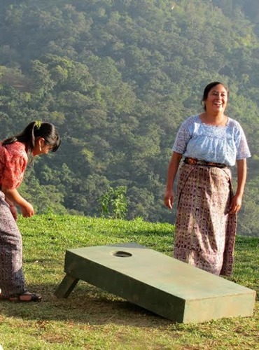 Teaching "the Chicas" to play Cornhole at Earth Lodge in Guatemala.