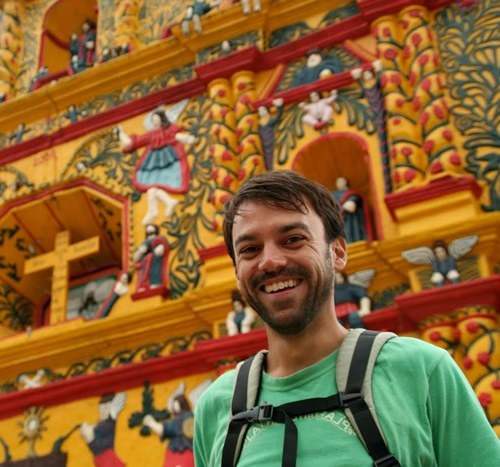 The author in front of a church smiling and enjoying life in Mexico.