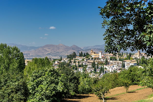 A view of an old hilltop village from another hillside.