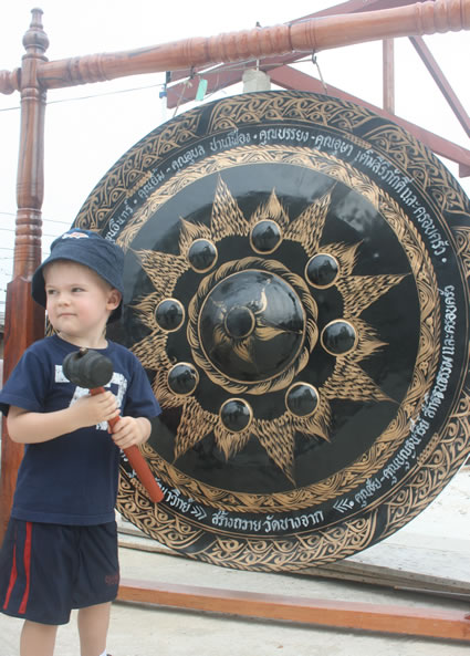 The author's child taking a turn with the gong.