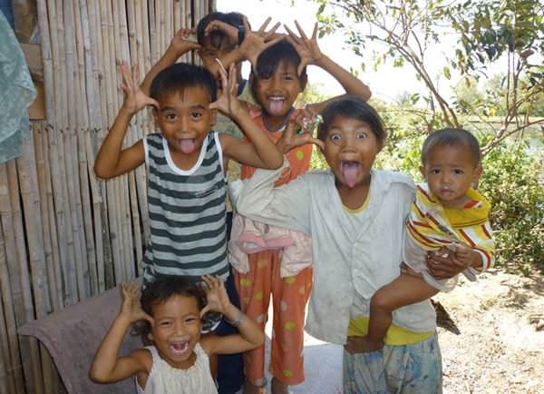 Playful children making faces at the British International School in Ho Chi Minh City.