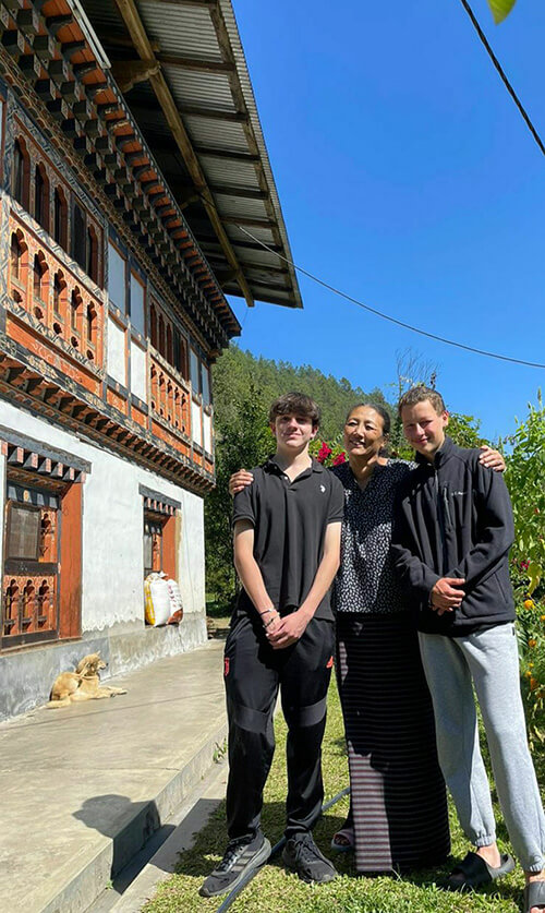 Owen and Archie at Ama Om's homestay for the weekend, an easy and affordable stay with meals and a riverside hot stone bath!