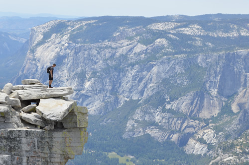 A student the top of a mountain during a gap year.