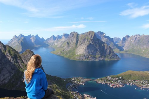 A teen looking over the mountains and sea