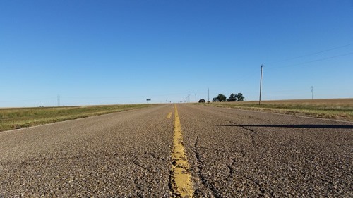 American road and yellow line.