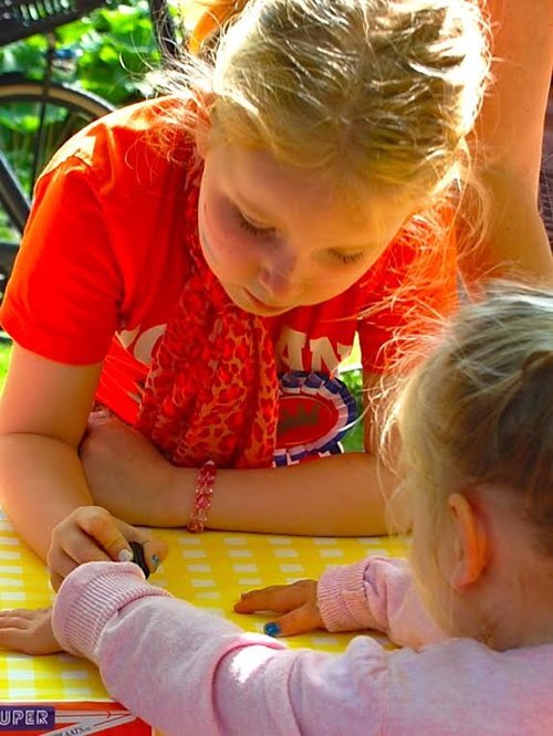 Child drawing during festival.