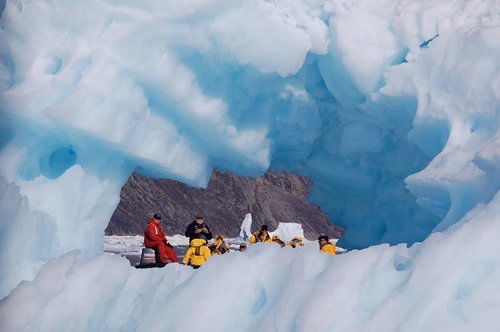 View of a boat through a sea ice formation.