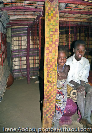 Two children on bed.