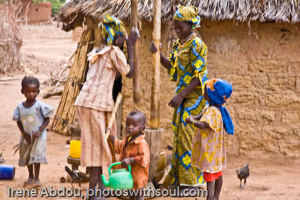 Two Fulani women pounding millet grain