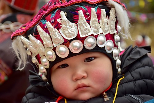 Miao baby's hat with auspicious silver symbols