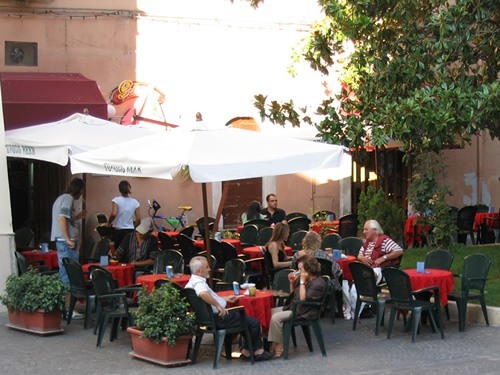 Casual country dining at an ourdoor cafe in Italy.