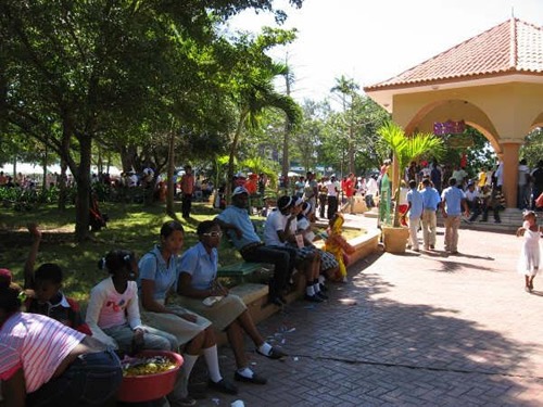 Dominican Republic crowds waiting in the shade for the Carnival to begin.