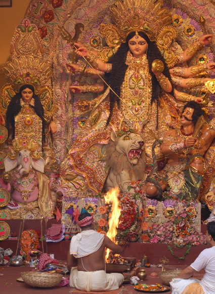 Priest performing ceremony during Durga Puja in India