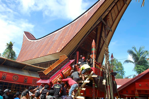 Coffin carried upstairs.