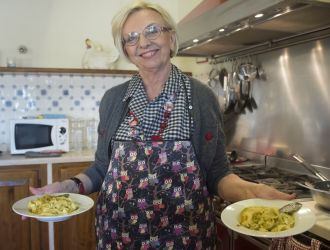 Nonna Ciana shows off some of her homemade pasta in her kitchen in Italy