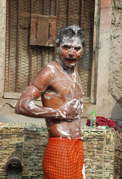 Bathing in the street in Kolkata.