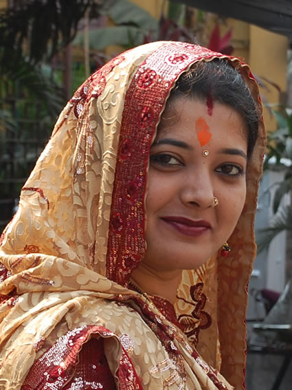 A newlywed in full dress in Kolkata.