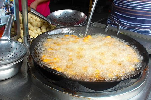 Wok with sweet potato balls.