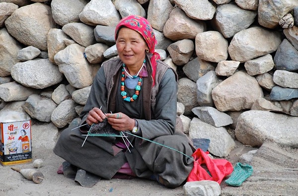 Hostess in the kitchen of her guesthouse in Chilling village in Ladakh.