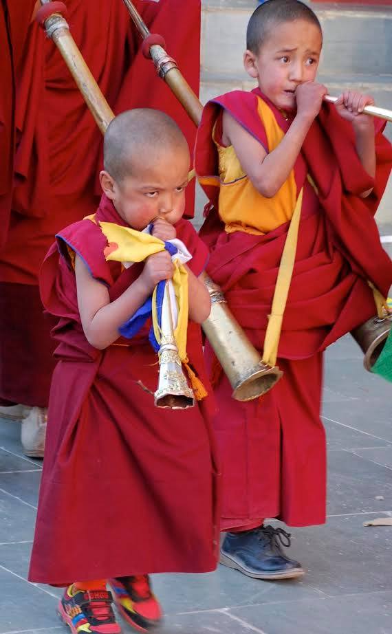 Monks dancing in colorful masks