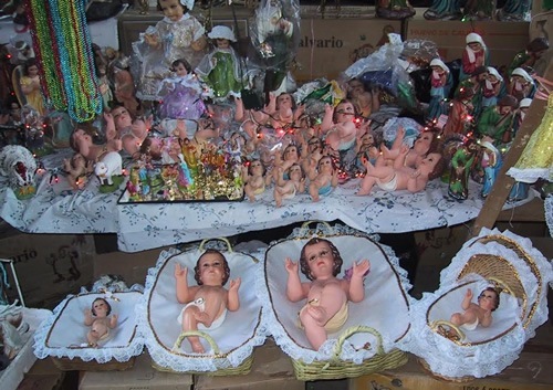 Figures of the baby Jesus at the market.