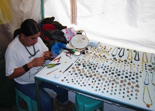 Selling souvenirs at market in Mexico.