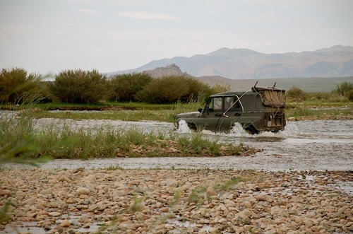 Jeep crossing river.
