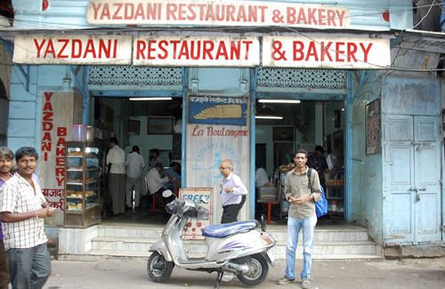 Rehan and scooter in front of legendary 'Yazdani Bakery'