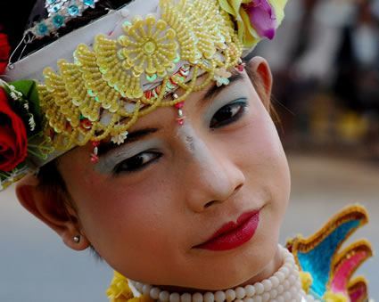 A boy dressed for his monk initiation.