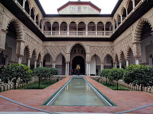 A courtyard in the huge Alcázar Royal Palace in beautiful Sevilla, Spain is a revelation during the shoulder season or Winter. 