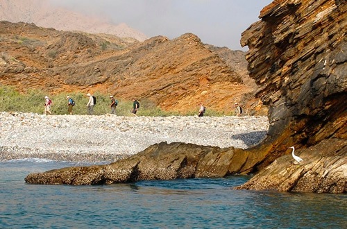 Hiking along the beach in Oman.